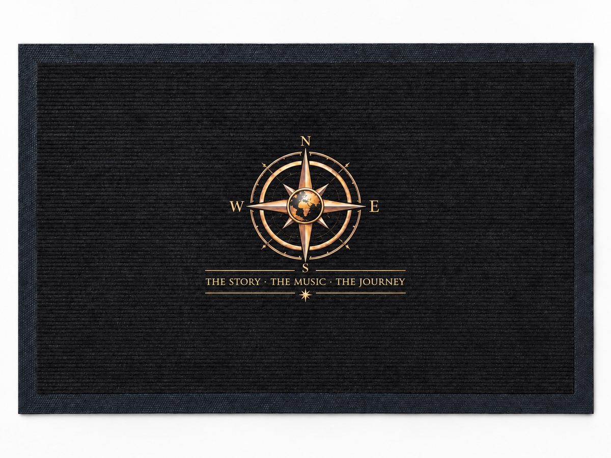 Pexlerian black doormat with gold compass design