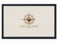 Pexlerian white doormat with black rubber border and gold compass design